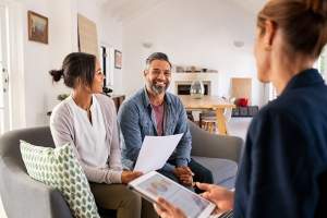 couple-talking-to-financial-advisor-at-home-2023-11-27-05-10-42-utc (1)