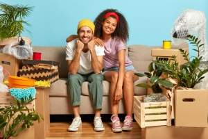 optimistic-multiethnic-couple-pose-on-sofa-settle-2025-01-24-05-40-44-utc (1) (1) (1)