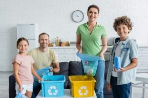 cheerful-family-with-trash-bags-and-boxes-with-rec-2024-11-15-03-31-24-utc (1)