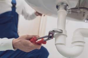 plumber-fixing-a-sink-at-home-2024-10-11-01-14-41-utc (1)