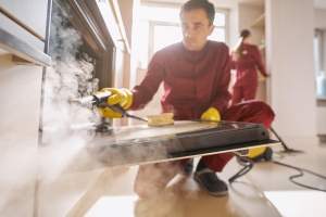two-experienced-cleaners-in-uniforms-cleaning-kitc-2025-03-05-05-06-05-utc (1)